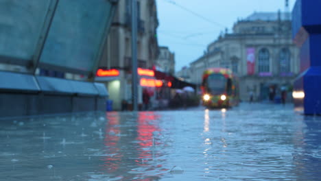 Pool-of-water-Montpellier-place-de-la-comédie-rainy-day-France-tramway-opera